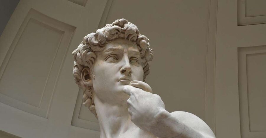 Florence: Private City Walking Tour with Accademia & Uffizi - Walking through Florence’s historic center