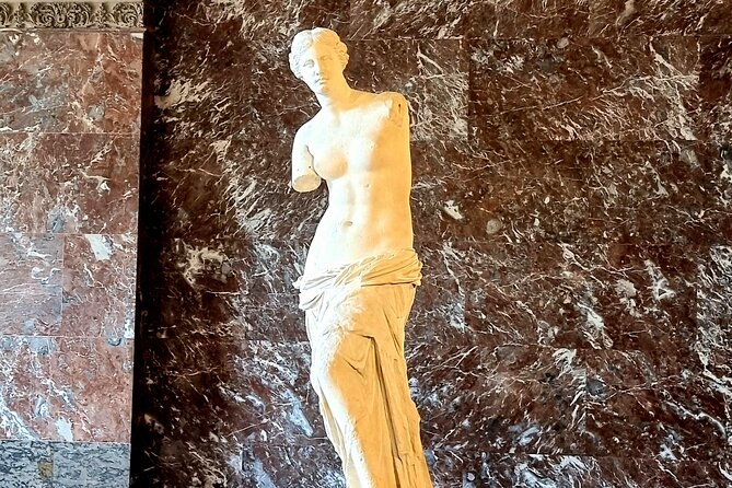 Paris Private Day Tour including Louvre Masterpieces Private Tour - A quick run along the Champs-Elysées