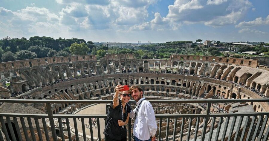 Rome: Colosseum & Vatican Museums Combo Tour - Entering the Colosseum with a guide